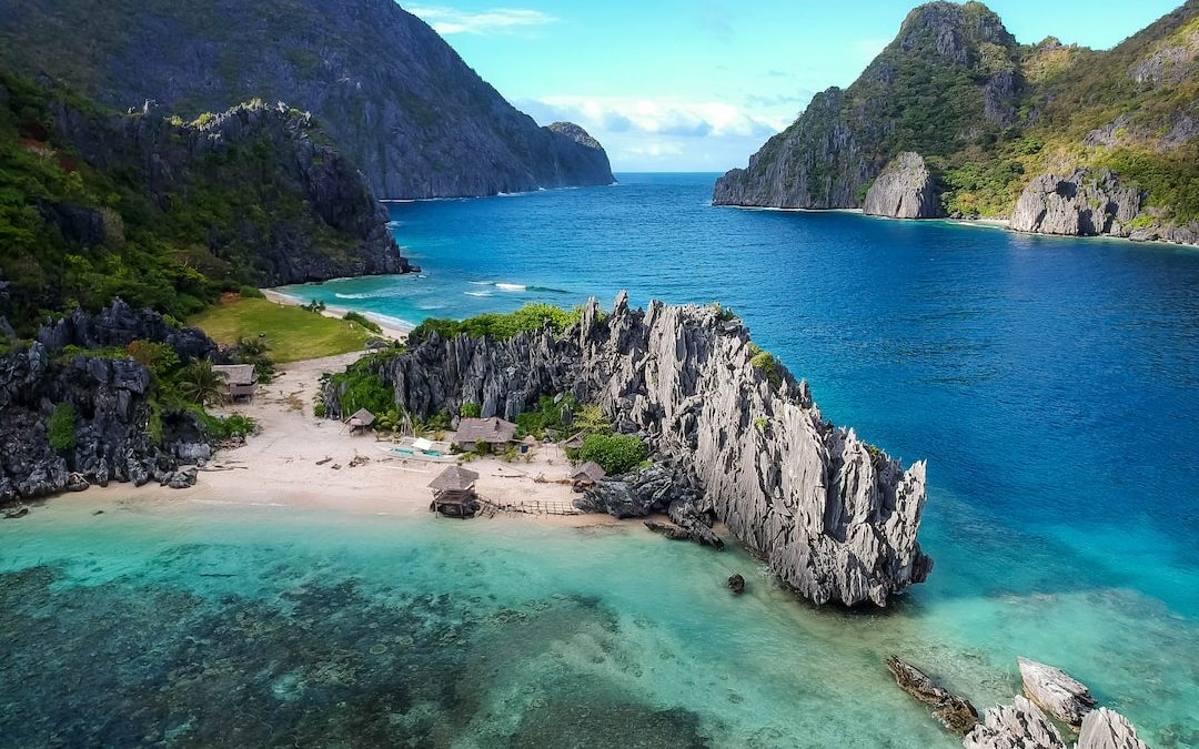 aerial photo of body of water between mountains