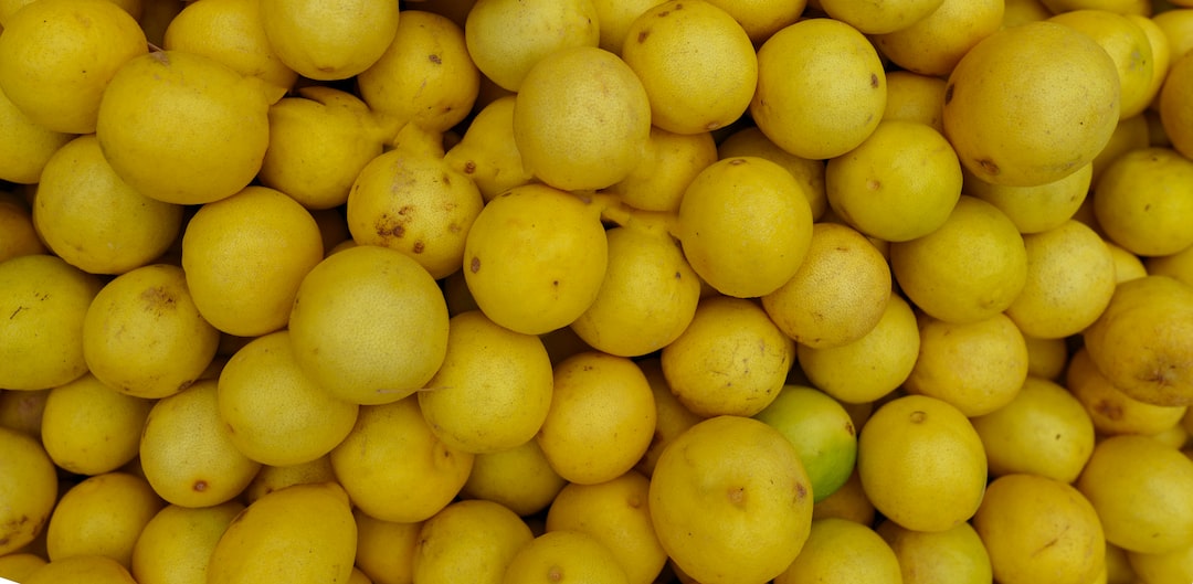 yellow round fruits on white ceramic plate