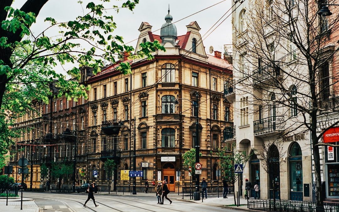 people walking near beige building