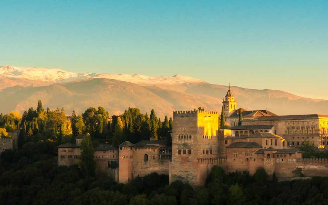 beige castle within mountain range