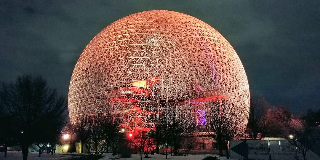 gold sphere landmark at night time
