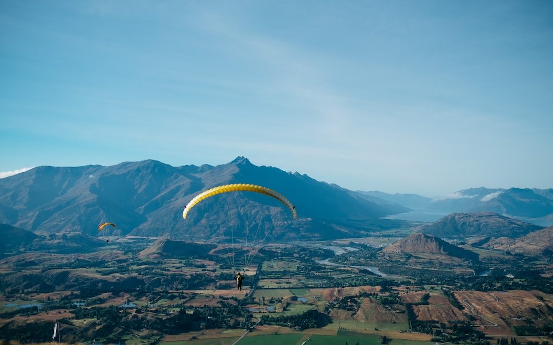 bird's-eye view photography of person in parachute