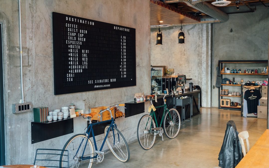 two bikes parked beside wall inside room