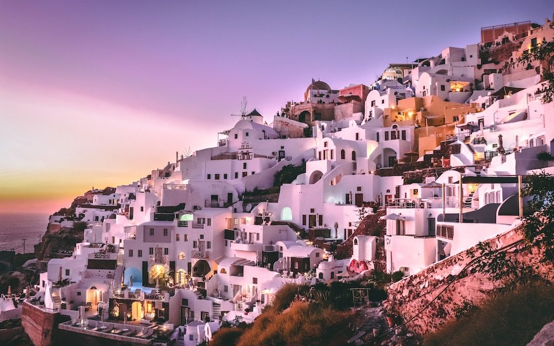 white concrete houses on hill during daytime