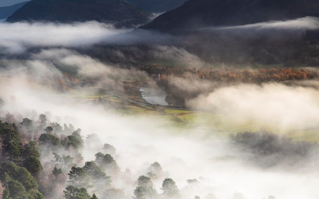 a mountain with clouds