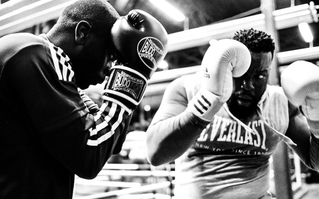 two men wearing boxing gloves