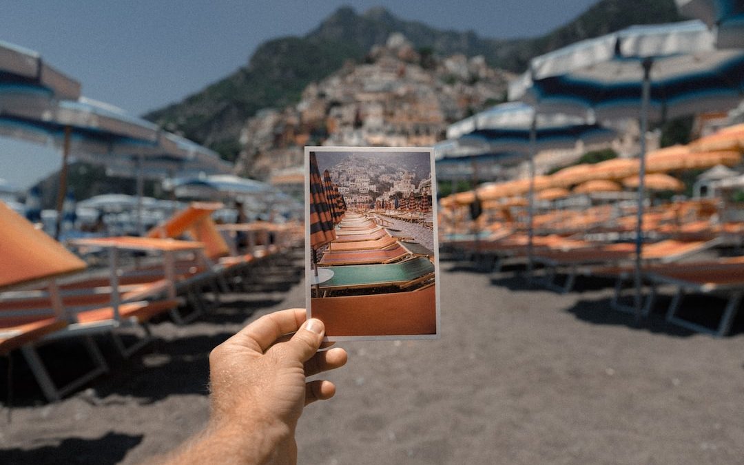 person holding outdoor lounge chairs photo