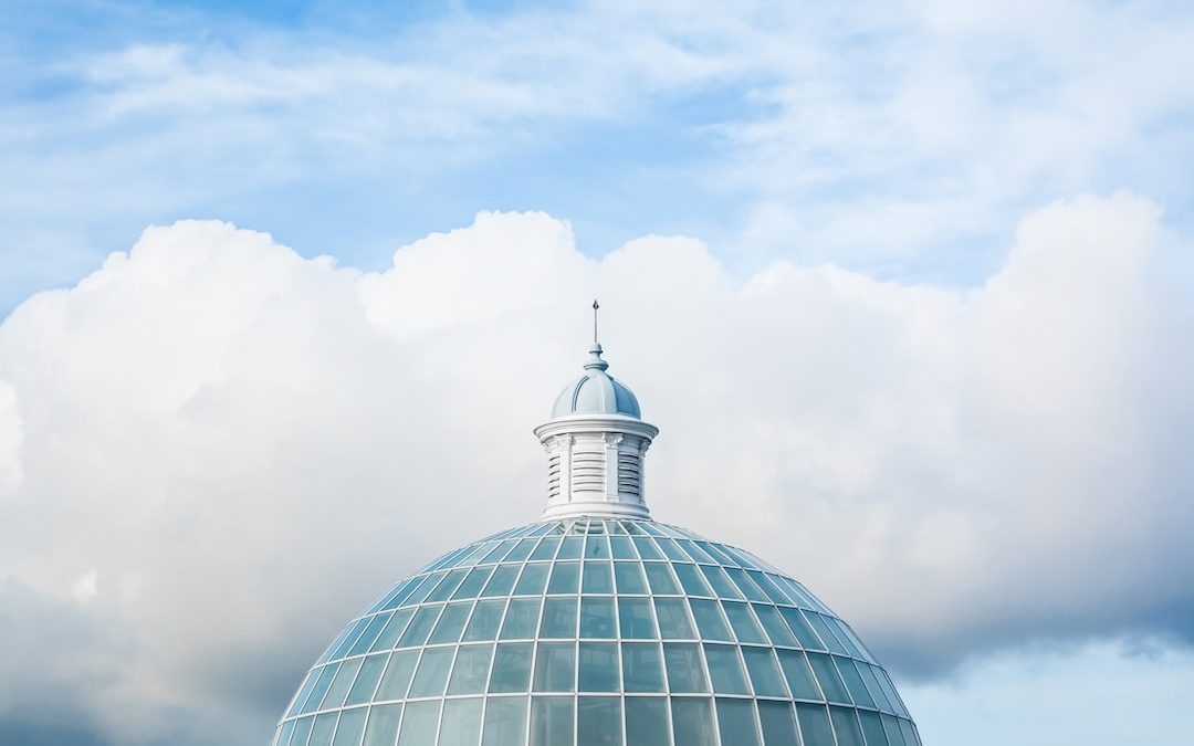 green and white dome tower under white and blue sky at daytime