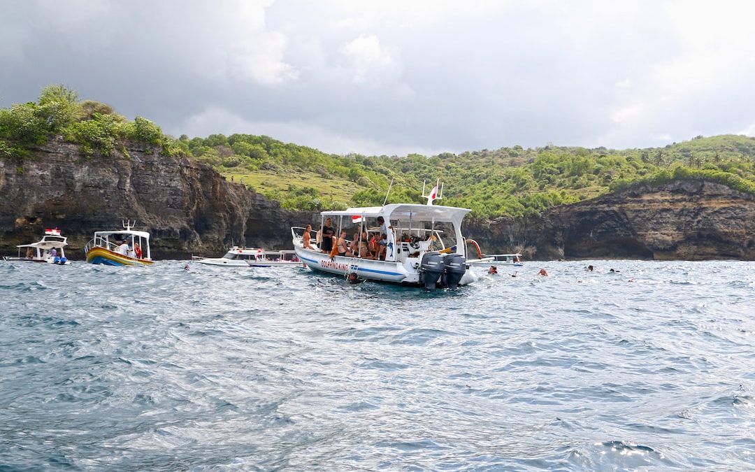 a group of people on a boat in the water