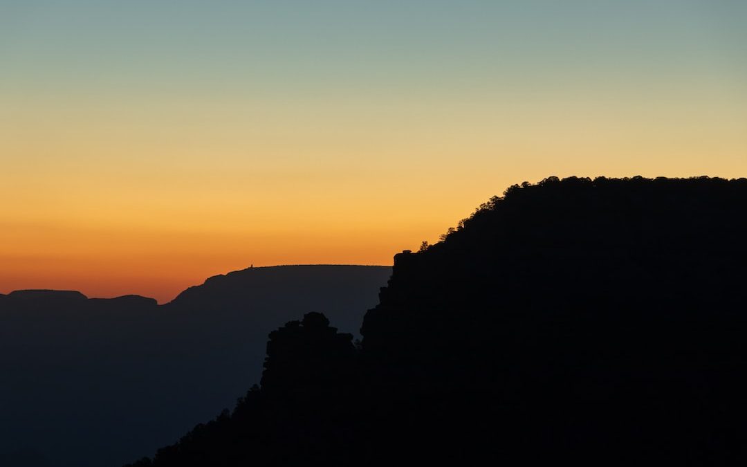 silhouette of mountain during sunset