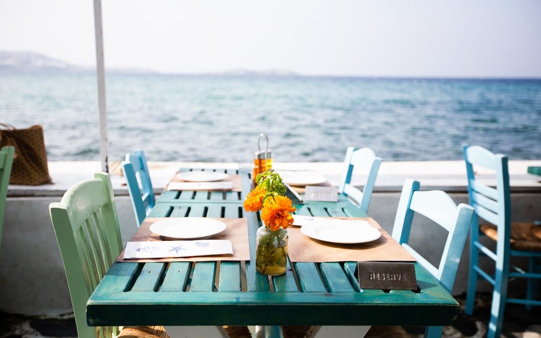 plates on dining tables by the sea