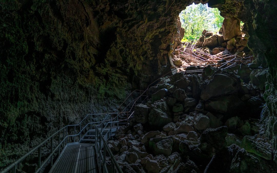 gray bridge inside cave