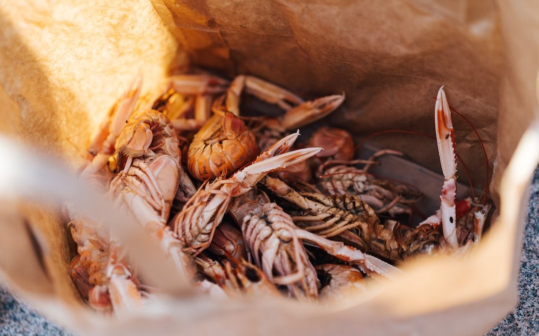 crabs in brown paper bag