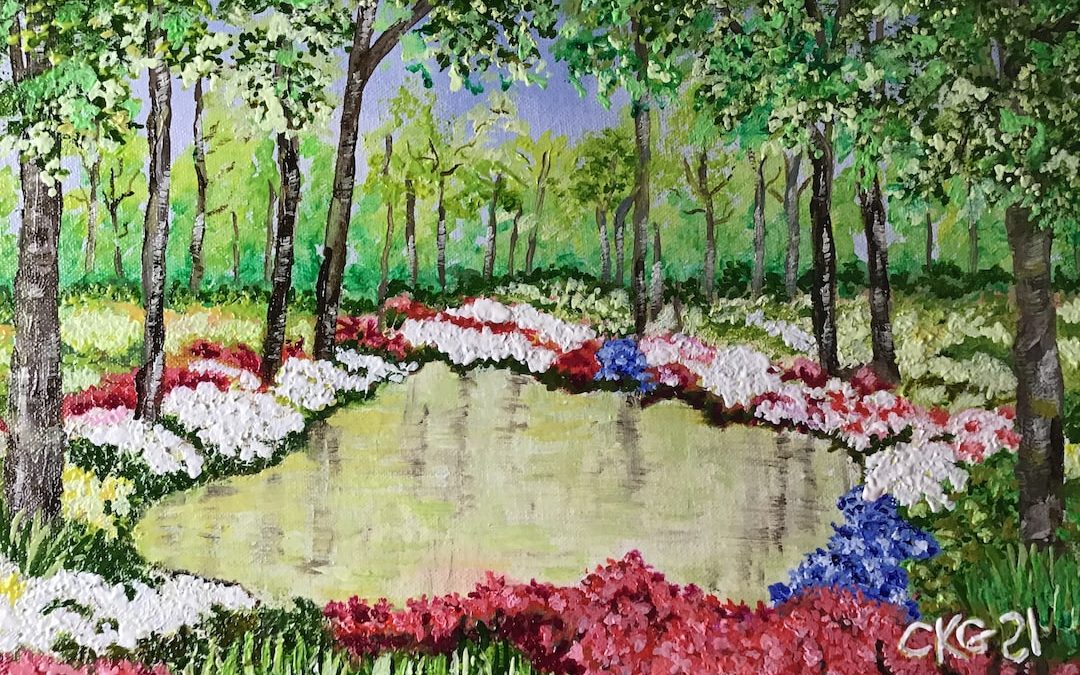 red blue and white flowers on green grass field