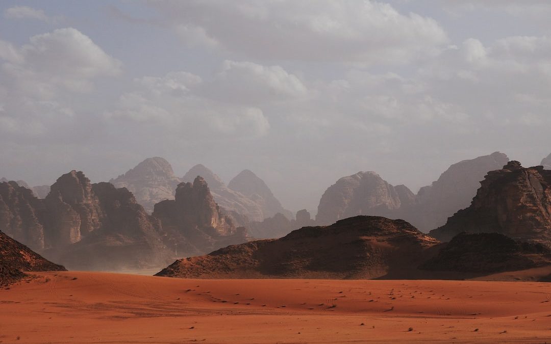 mountains under white clouds at daytime