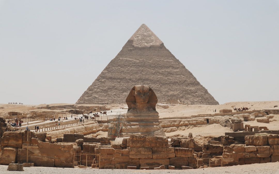 a pyramid with people standing around