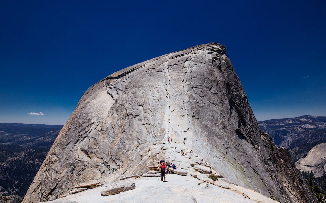 person standing on rock formation