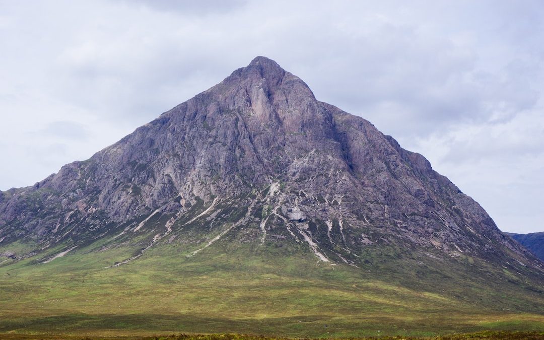 gray mountain under gray sky during daytime