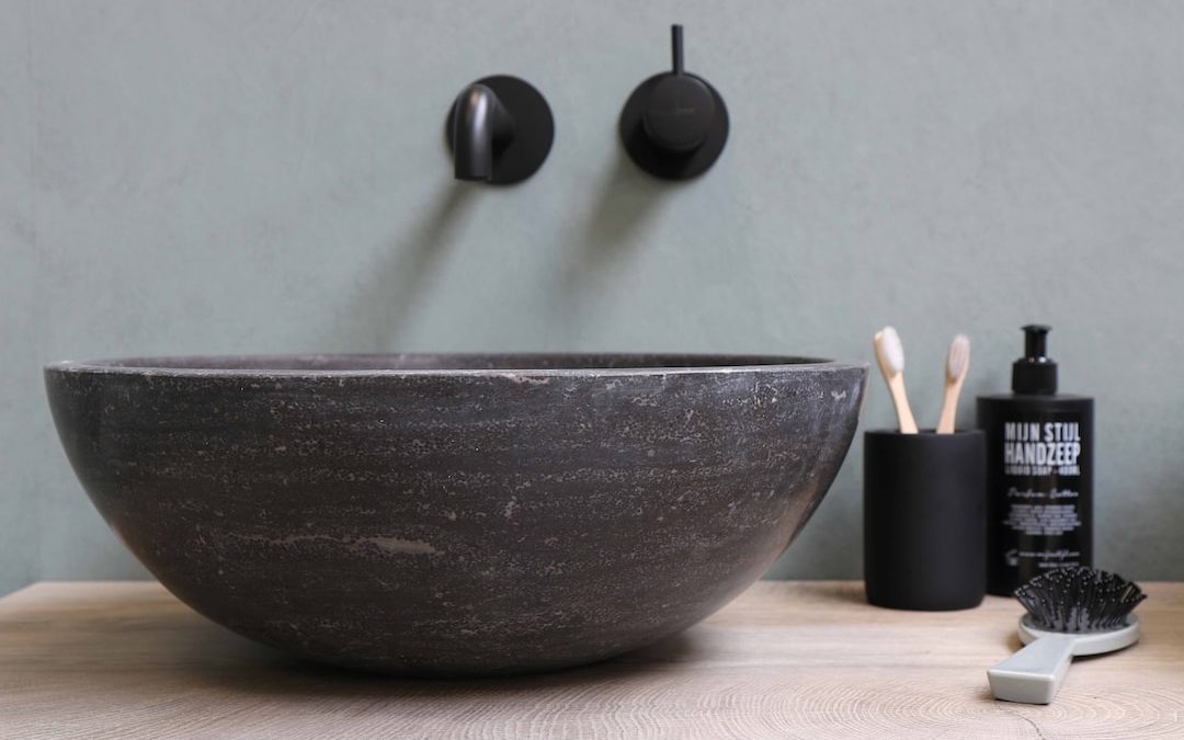 blue ceramic bowl with white candles