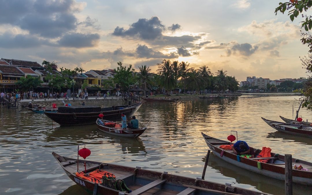 people riding on boat on water during daytime