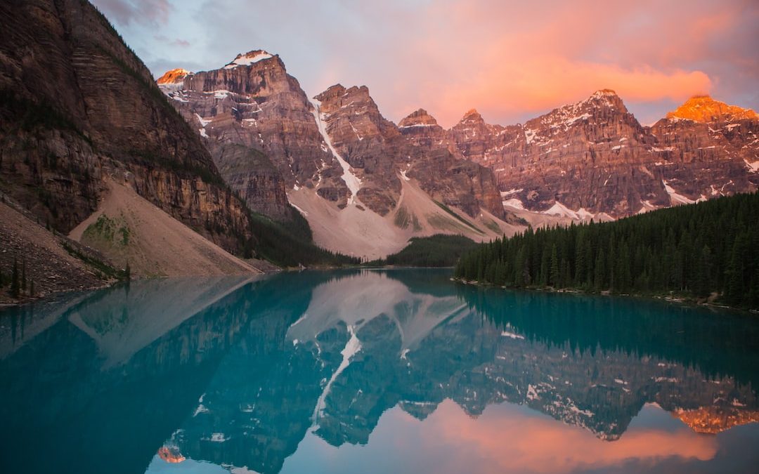 mountain reflection on body of water