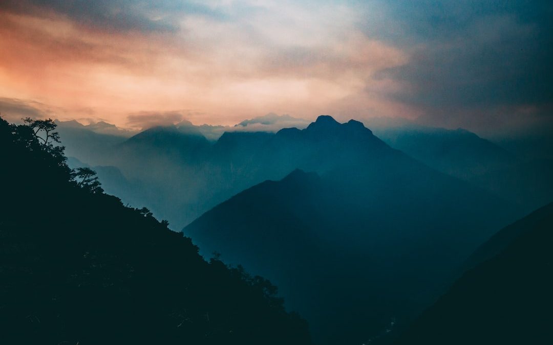 bird's eye view of mountain with fog