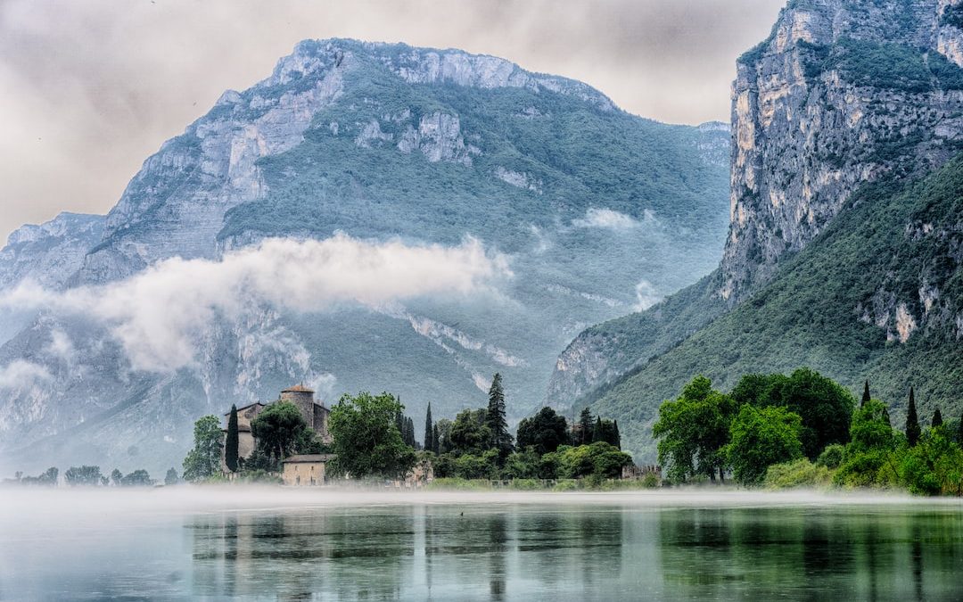 lake across mountain and trees