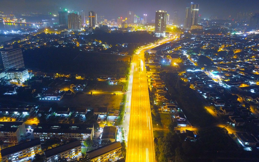 city with high rise buildings during night time