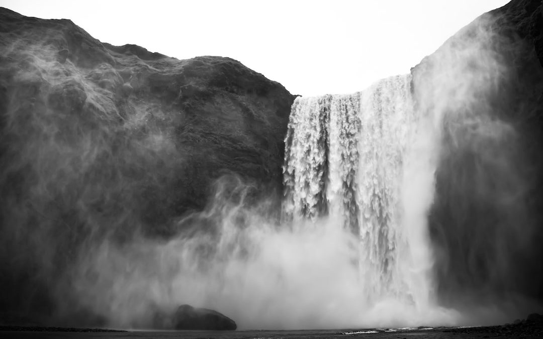 greyscale photo of waterfalls