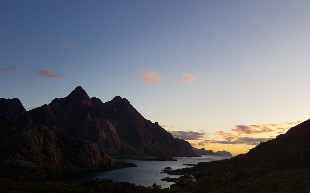 aerial view of body of water between mountains during golden hour