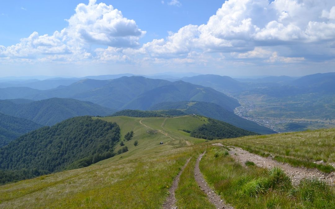 a dirt road in a valley