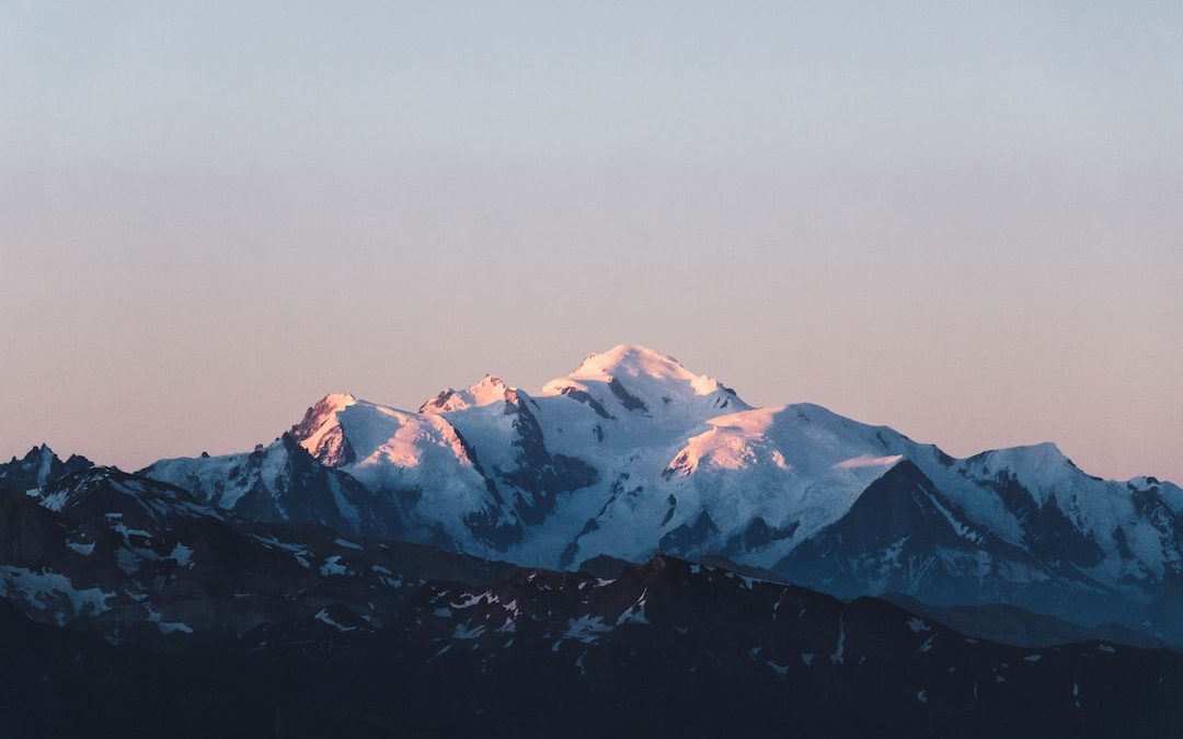 snow covered mountain during daytime