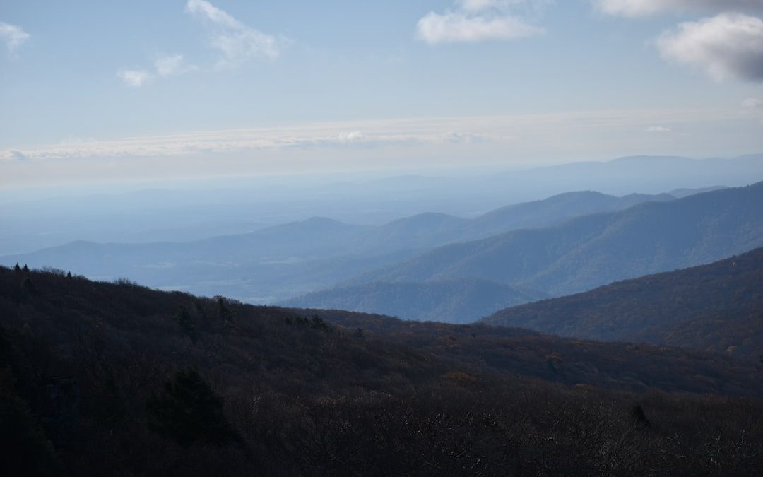 green and brown mountains under blue sky during daytime