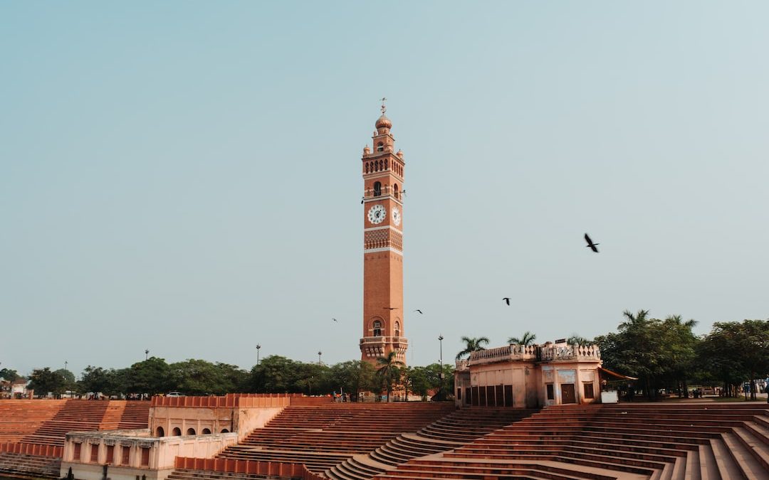 a tall clock tower towering over a city