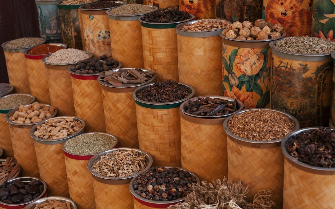 a bunch of tins filled with different types of nuts