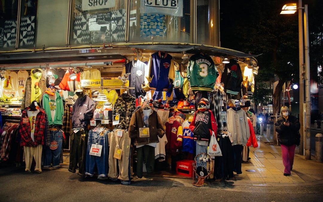 a group of people standing in front of a store