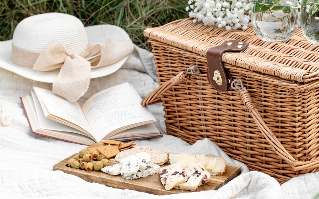 white and brown wicker basket with white textile