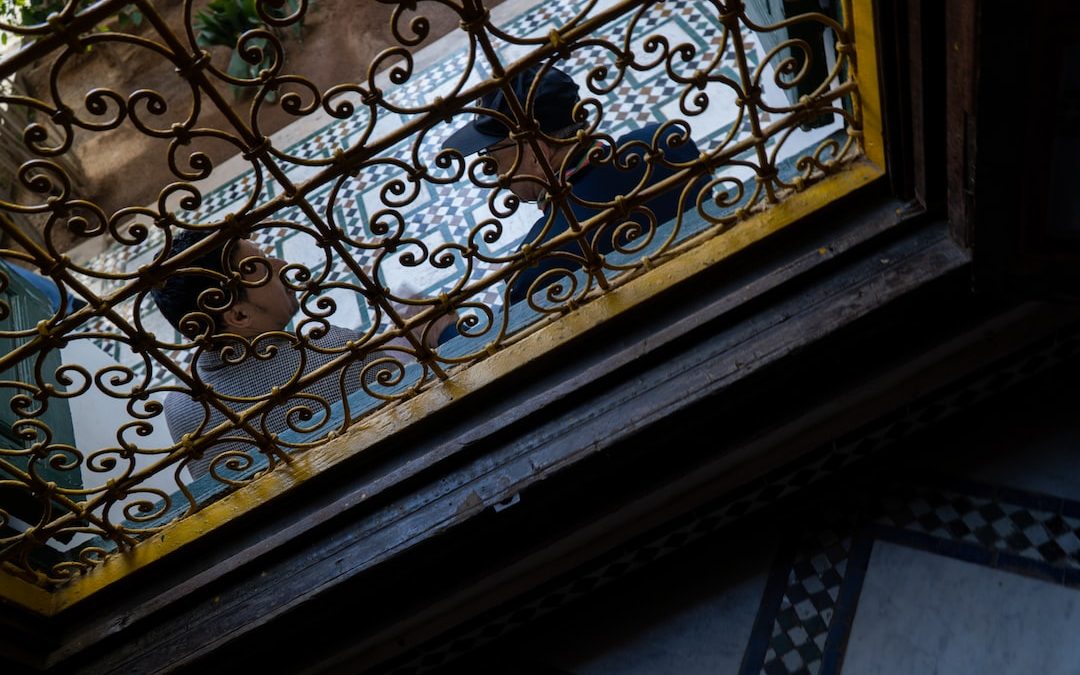 a close up of a window with iron bars