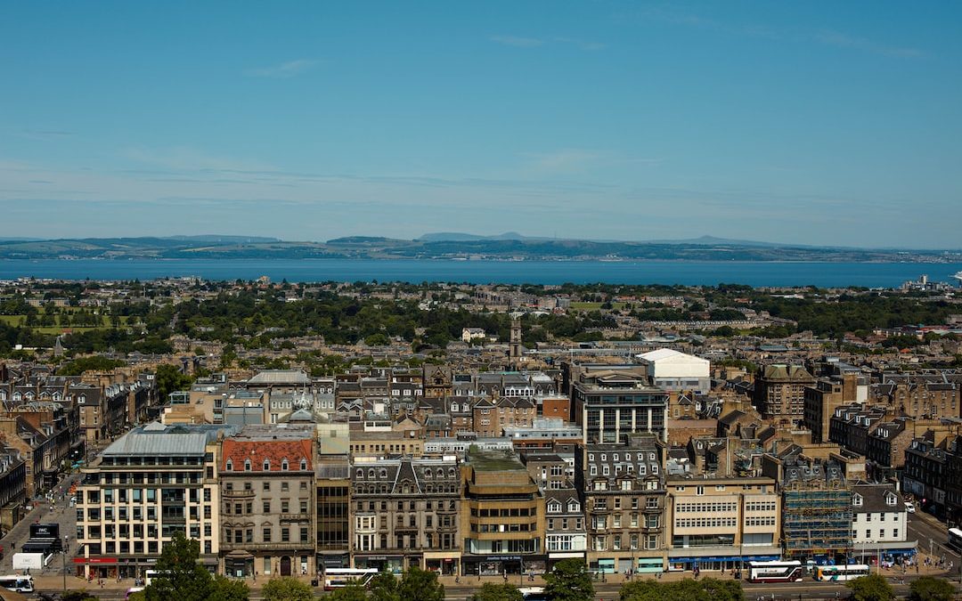 a view of a city with a body of water in the distance