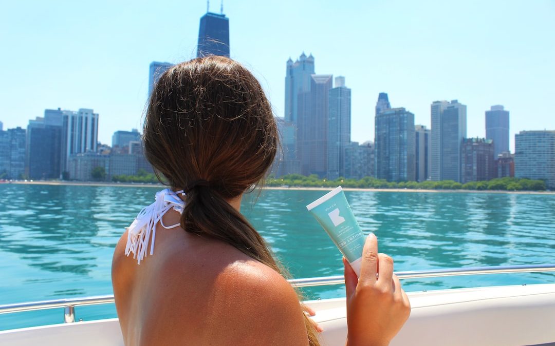 woman in pink bikini reading book on boat during daytime