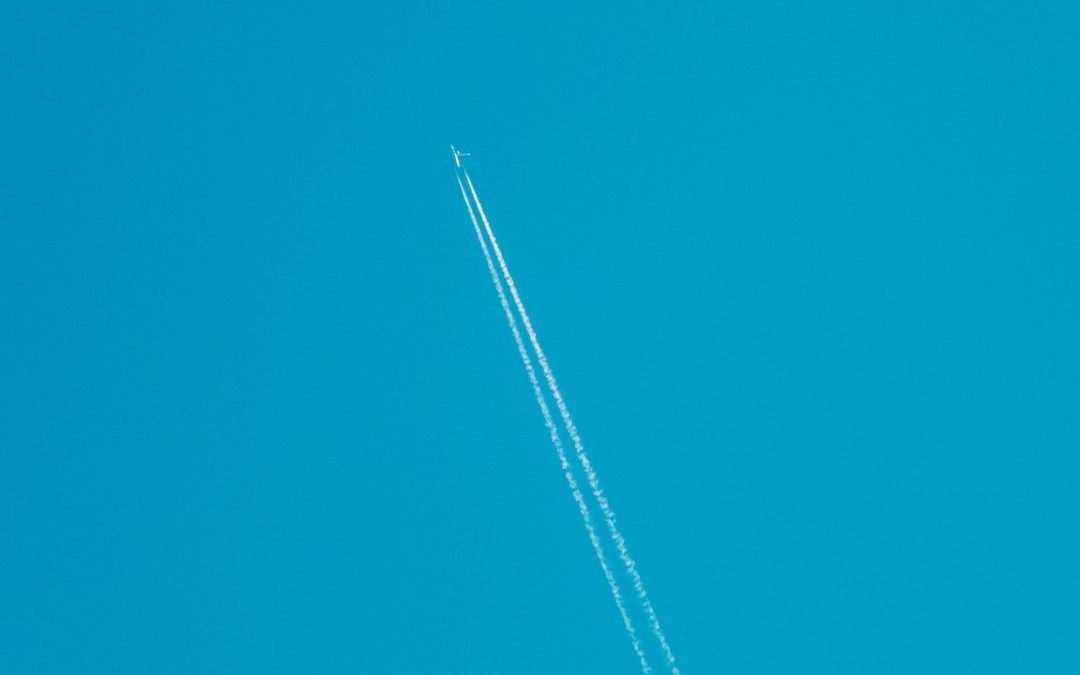white plane in the sky
