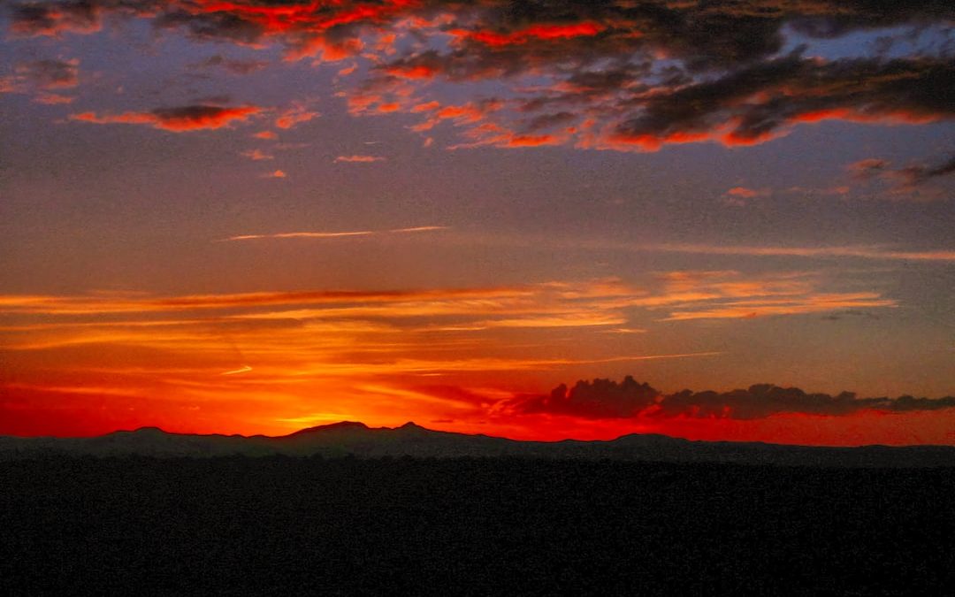 silhouette of mountain during sunset