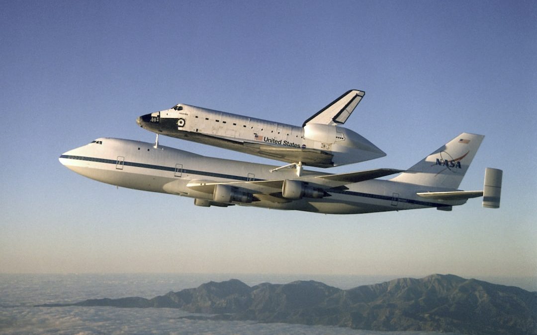 Airplane carries space shuttle in flight