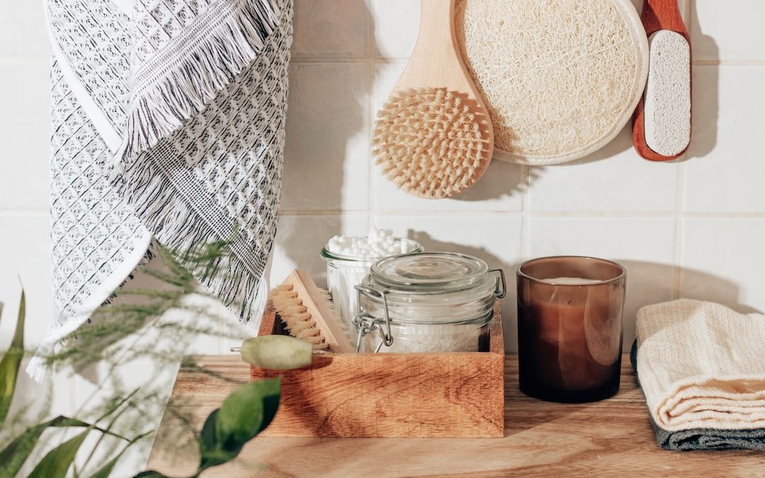 brown wooden chopping board beside clear glass jar