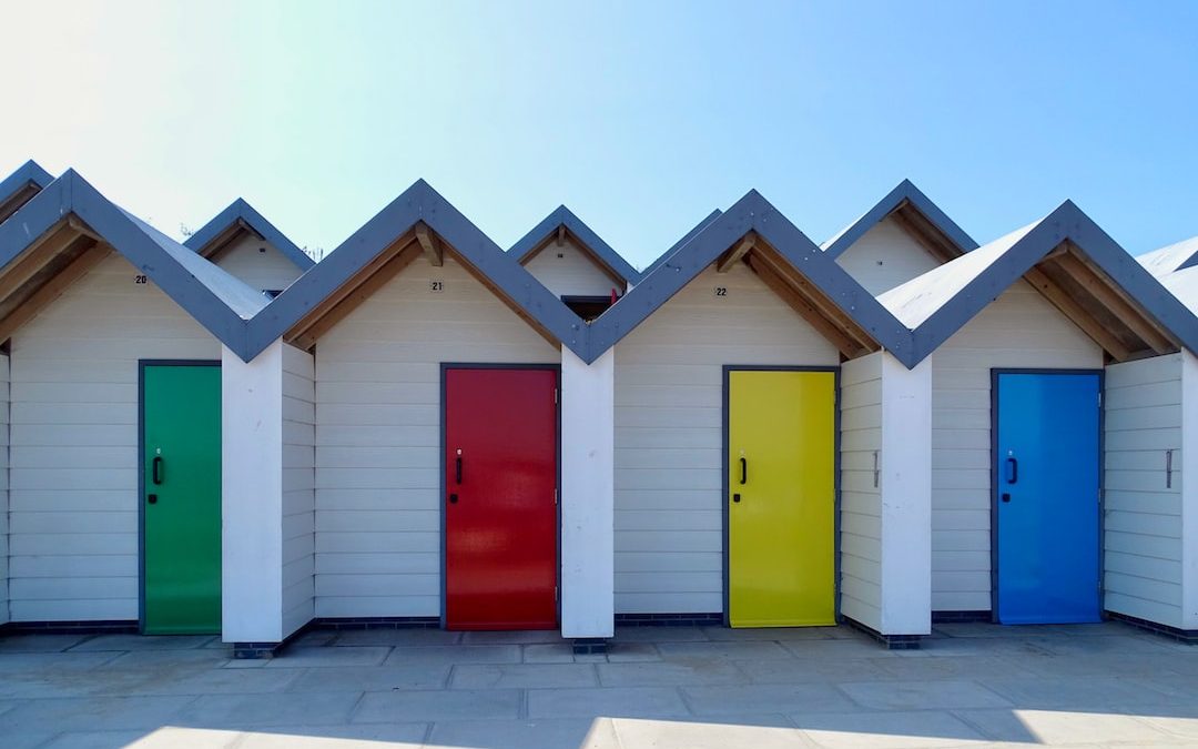 yellow red green and blue wooden houses