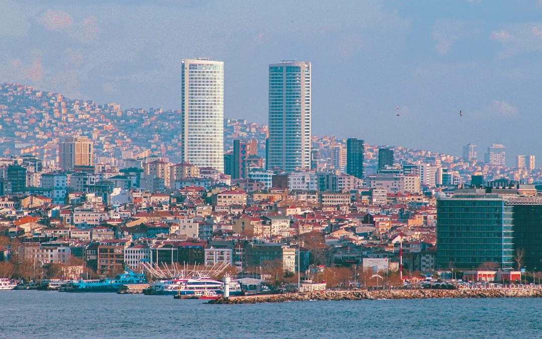 a large body of water with a city in the background