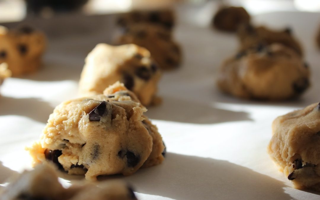 round chocolate cookies on white surface