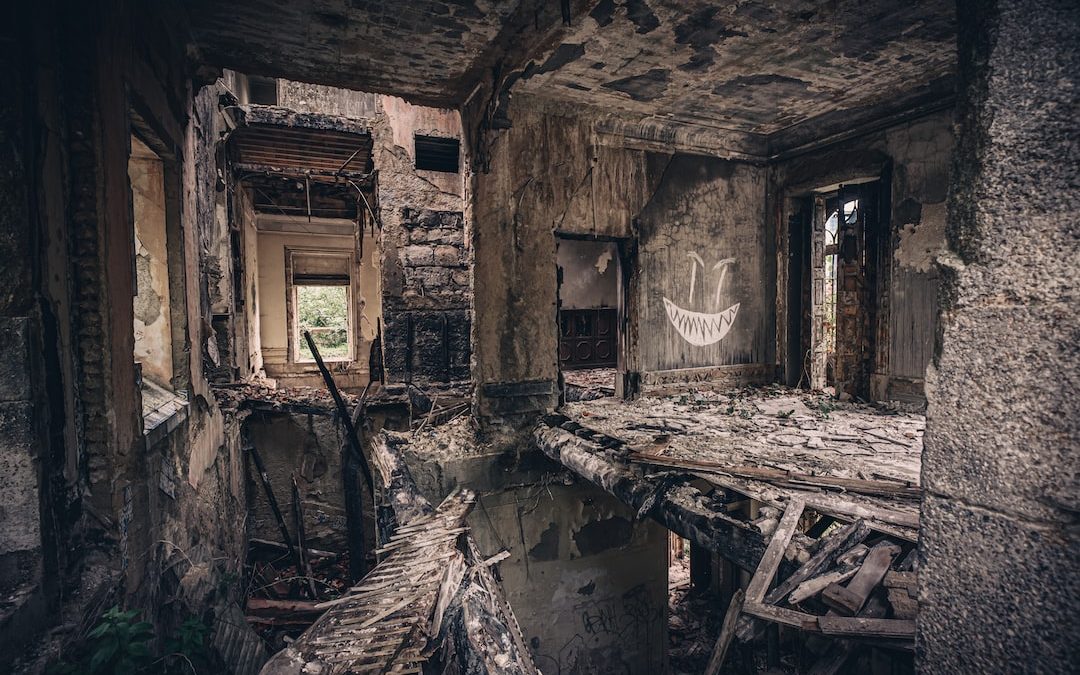 brown wooden table inside abandoned building