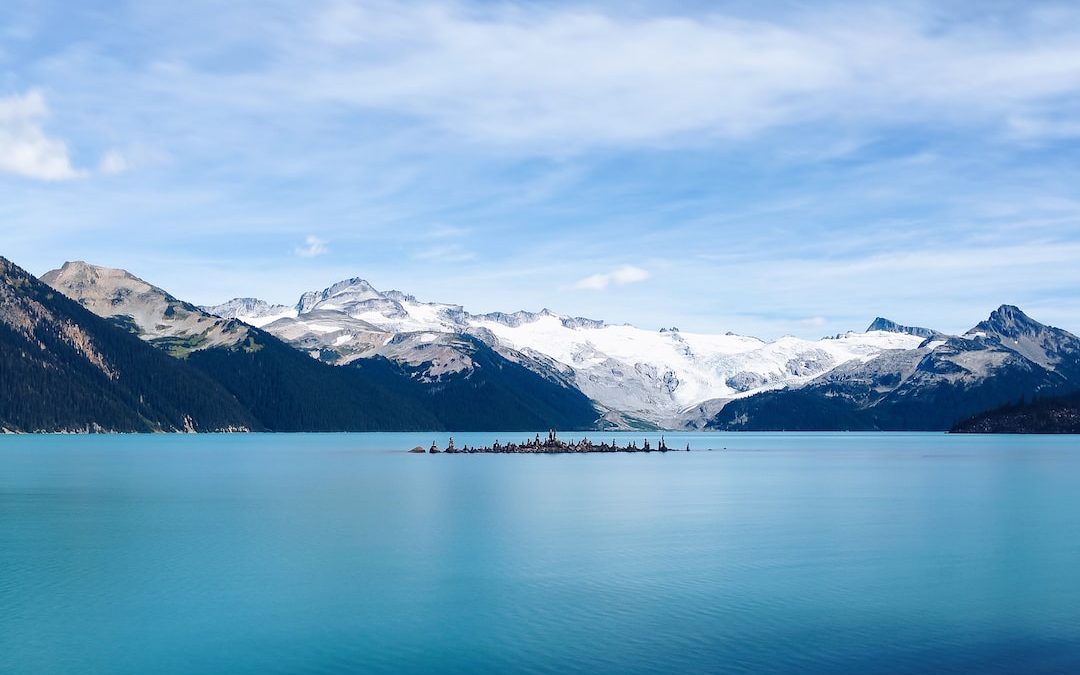 aerial view photography of mountain and body of water