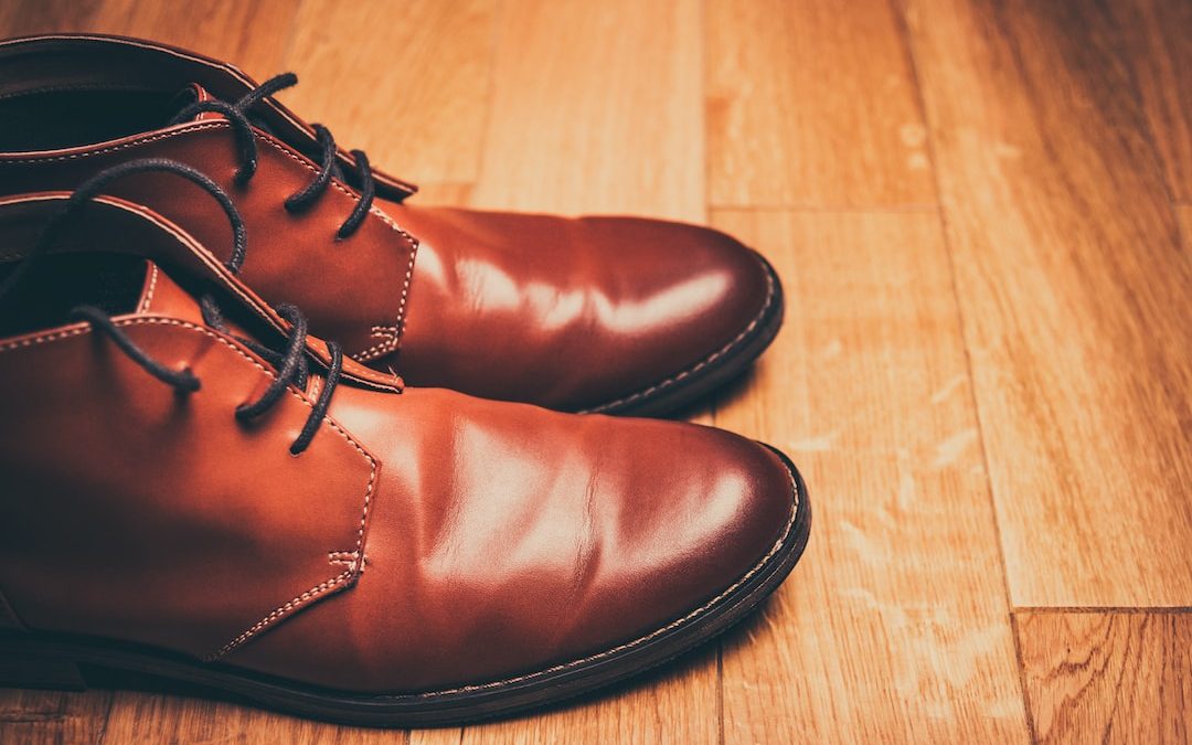 pair of brown leather lace-up boots